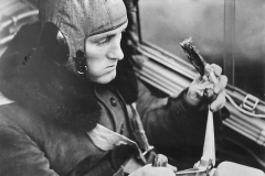 German_pilot_eats_pemmican_sausage_in_Bf_110_cockpit_40