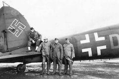 GI_Posed_by_Captured_Luftwaffe_Bomber_He111