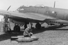 Heinkel_He111_and_bombs_