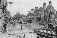 1st Army Trucks and Jeeps in Ruins of Isigny Normandy 1944