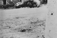 American_Soldiers_Blast_German_Tank_with_Bazooka_in_Normandy_1944