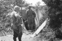 American_Soldiers_Search_German_Tunnel_in_Normandy_France