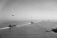 Convoy_of_LCTs_and_barrage_balloons_preparing_for_D-Day_Invasion