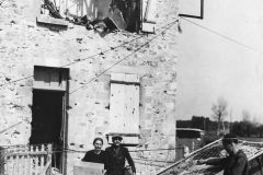 French_Family_Leaving_Ruins_of_Their_Home_in_Carentan_Normandy_1944