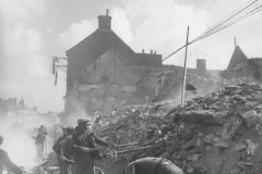 French_Refugees_Digging_Through_Rubble_Isigny-sur-Mer_Normandy_June_1944