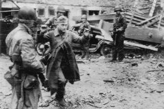 German_Surrenders_hands_up_in_Cherbourg_1944
