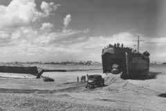 LST_Ship_Unloading_Trucks_D-Day_Beach_Normandy_1944