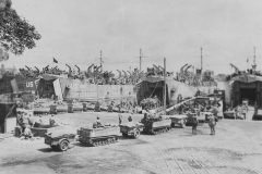LSTs_loading_tracked_vehicles_carts_for_D-Day_assault_in_England