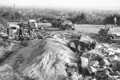 M8_and_Jeep_passing_wrecked_German_vehicles_in_Avranches