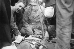 Medics_transferring_wounded_soldier_from_D-Day_beachhead