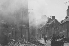 Photo_Fireman_Put_Out_Fire_in_Carentan_Normandy_France_1944
