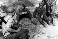Polish_prisoner_in_German_uniform_is_interrogated_by_US_soldiers_15_June_1944