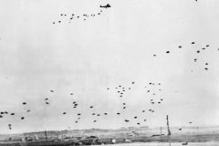 RAF_aircraft_drop_supplies_by_parachute_to_British_Airborne_Division_in_Normandy_1944