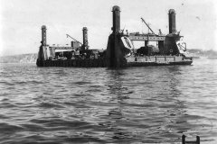 Spud_Pier_Section_of_Mulberry_B_Harbor_Arrives_at_Arromanches_Normandy