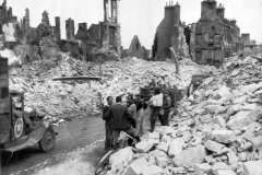 Truck_in_bombed_ruins_of_Valognes