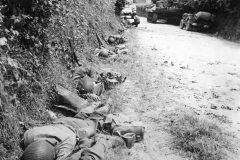 US_Army_Troops_Rest_in_Ditch_During_Advance_on_Cherbourg_June_1944_Normandy