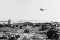 US_Army_trucks_move_inland_from_Omaha_Beach