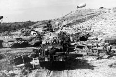 US_Army_vehicles_move_inland_from_a_Normandy_invasion_beach