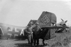 captured_Junkers_Ju_87_tail_and_us_soldiers