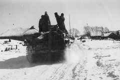 German_troops_riding_on_Panzer_III_tank_Russia