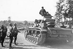 Panzer_III_passing_wehrmacht_troops