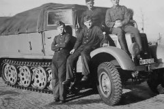 wehrmacht_soldiers_next_to_a_SdKfz_11_halftrack