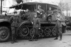 Wehrmacht_soldiers_next_to_a_SdKfz_6_halftrack