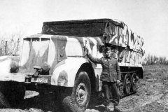 German_soldier_posing_beside_a_SdKfz_9