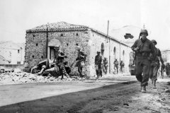 GIs_Pass_German_StuG_40_Santa_Agata_Sicily_1943